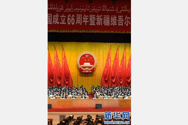10月1日，慶祝中華人民共和國(guó)成立66周年暨新疆維吾爾自治區(qū)成立60周年大會(huì)在新疆人民會(huì)堂隆重舉行。 新華社記者 高潔 攝 
